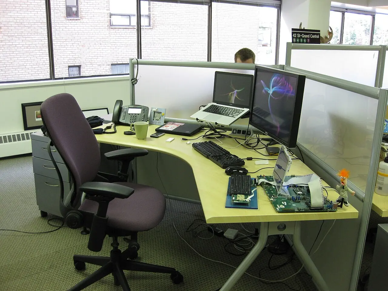Office workstation with monitors and a desk chair