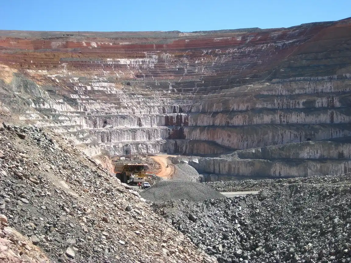 Terraced walls of a deep open-pit mine