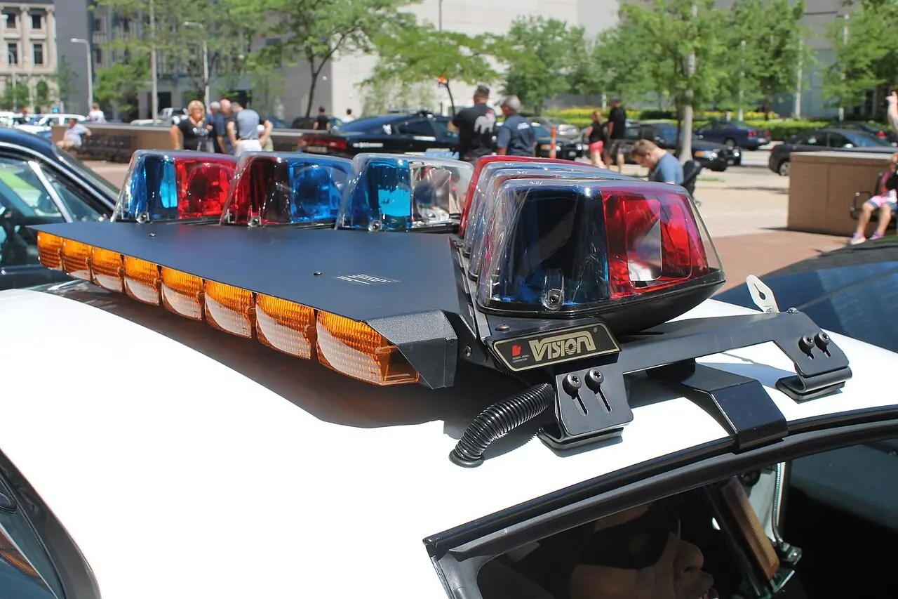 Red and blue rotating lights on a police car roof