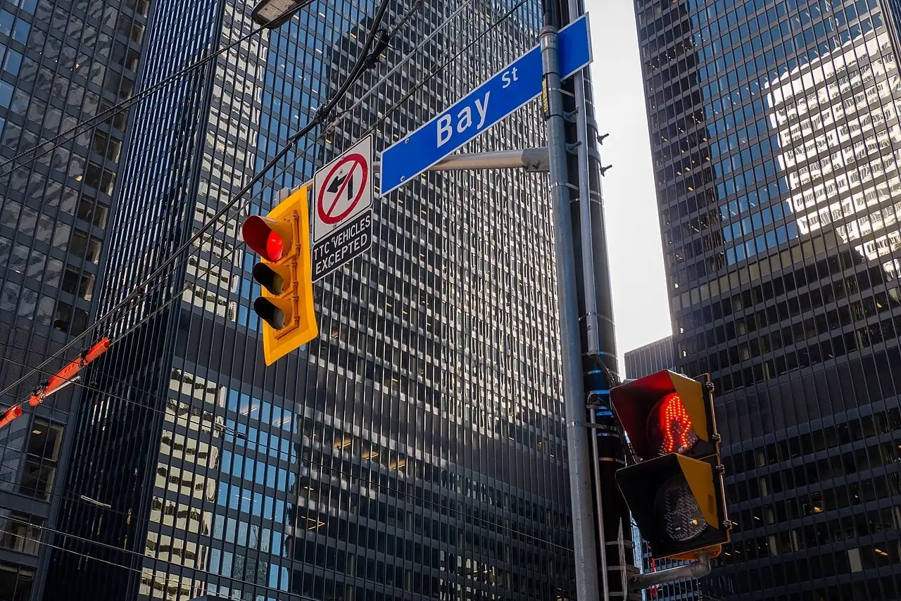 Bay Street sign among office towers in Toronto