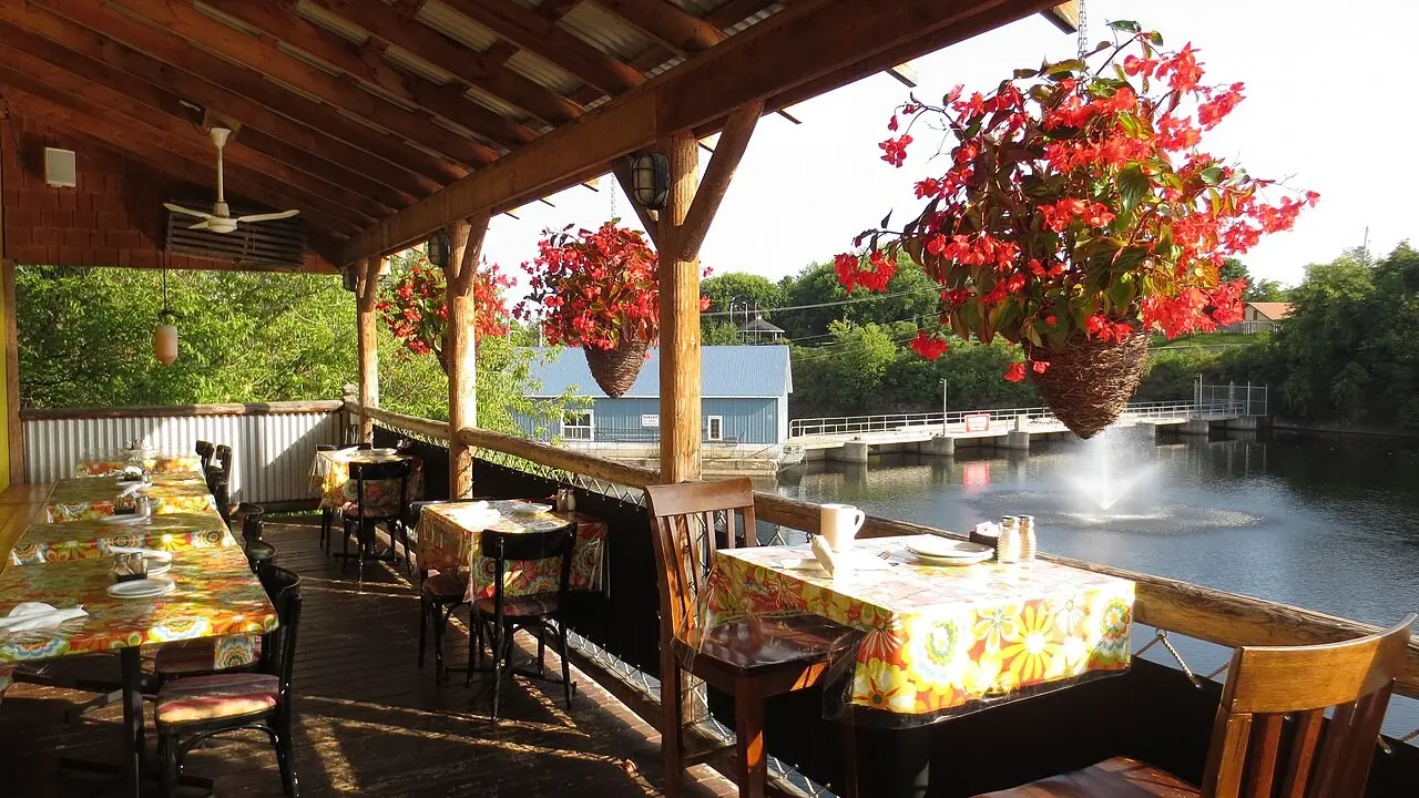 Restaurant deck with tables overlooking a river