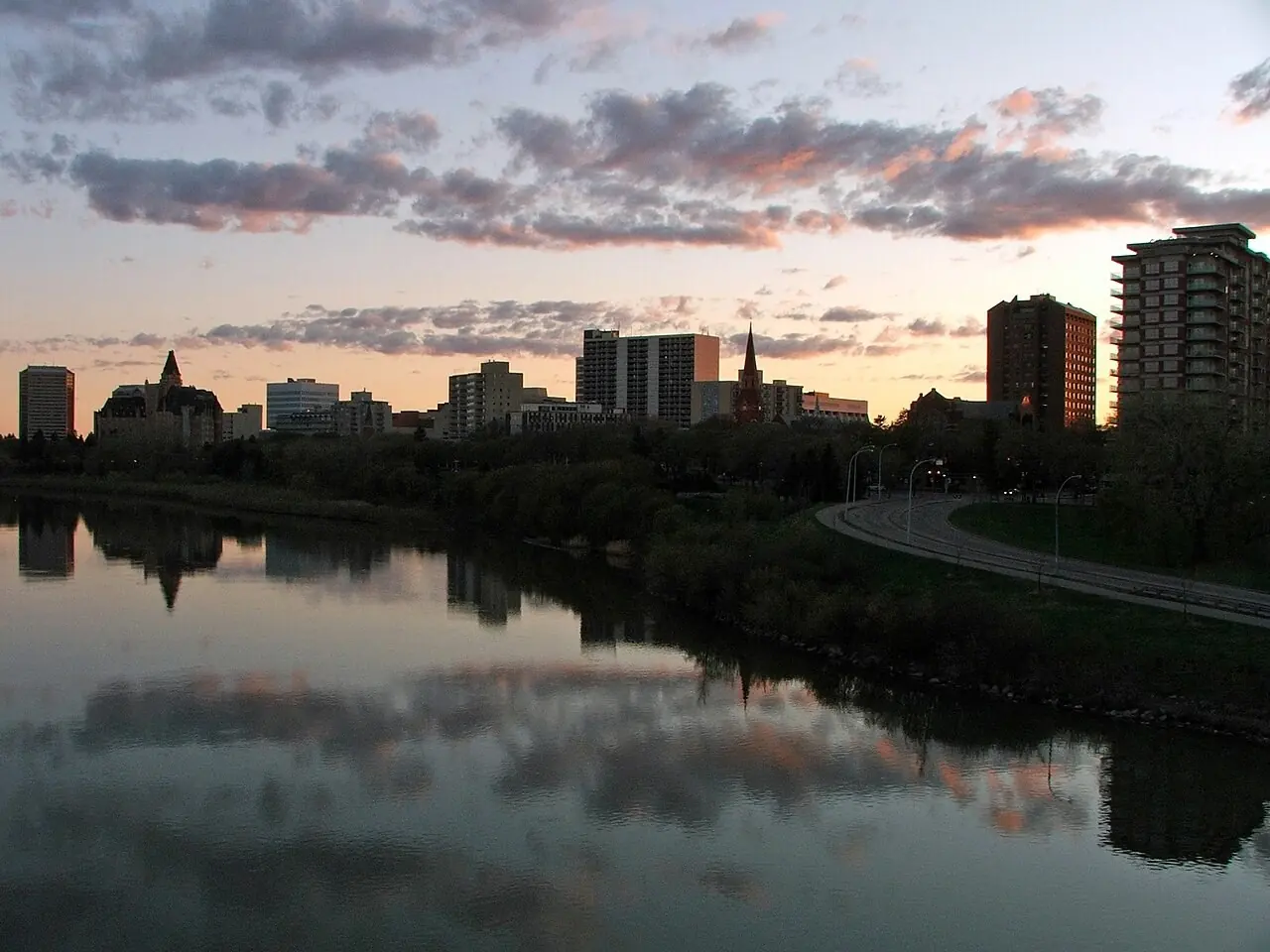Saskatoon skyline reflected in the river at sunset