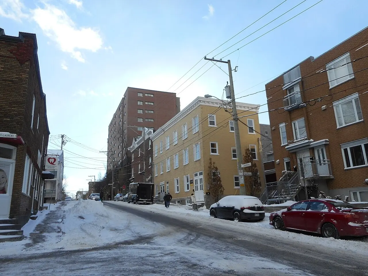 Apartment buildings on a snowy city street