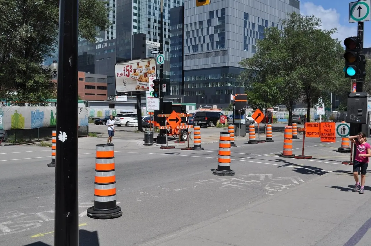 Barrels closing lanes at a downtown intersection