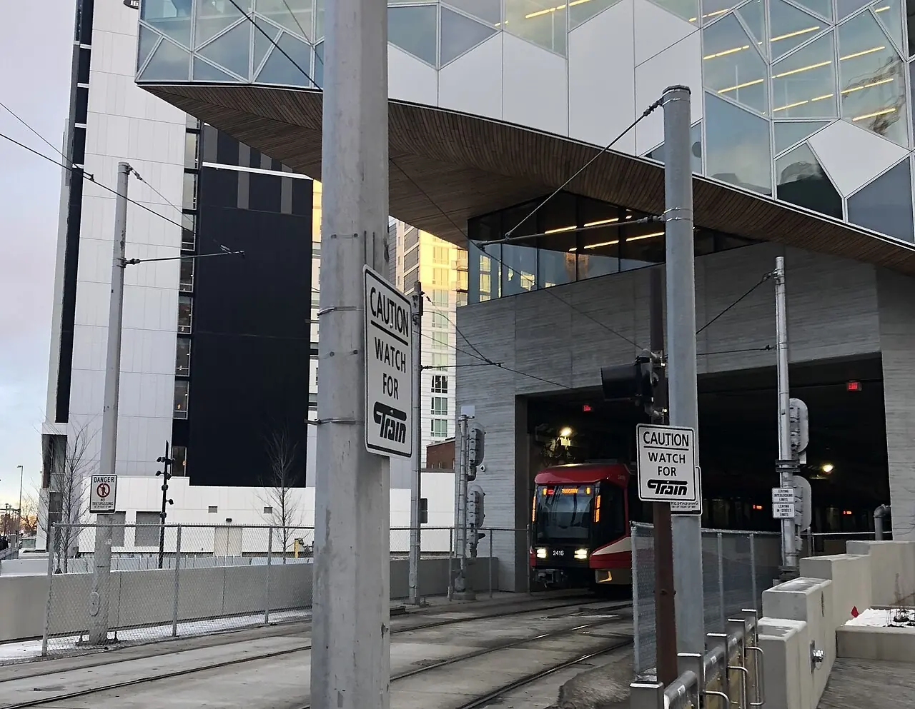 CTrain entering a tunnel below the Calgary Central Library