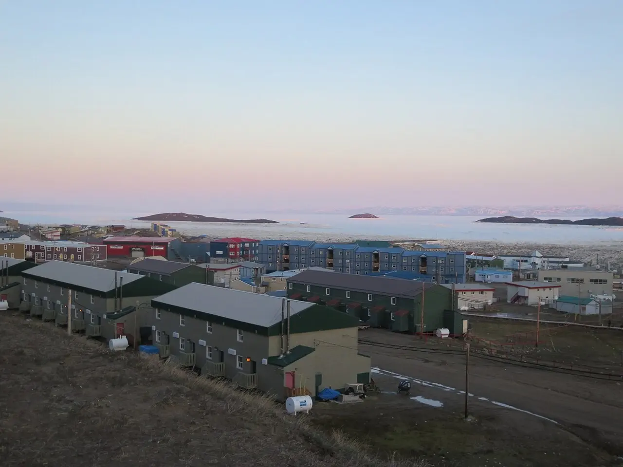 Rows of housing units in Iqaluit at dusk