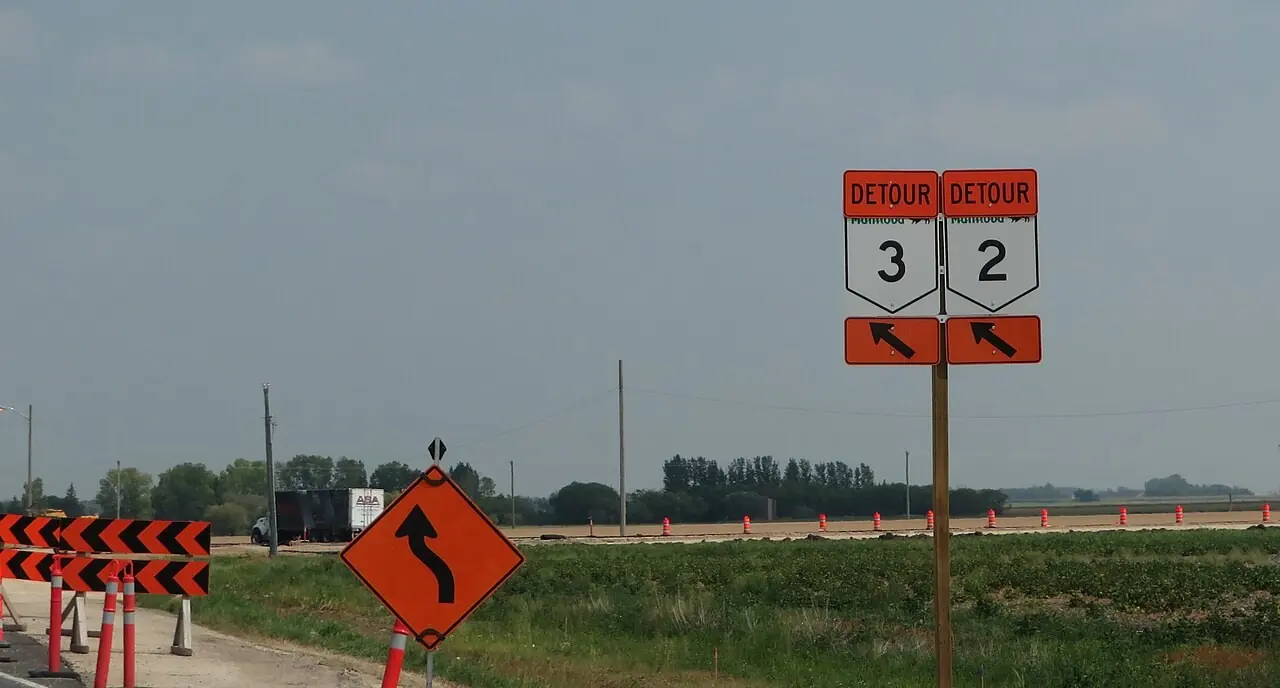 Detour route signs at a rural highway junction