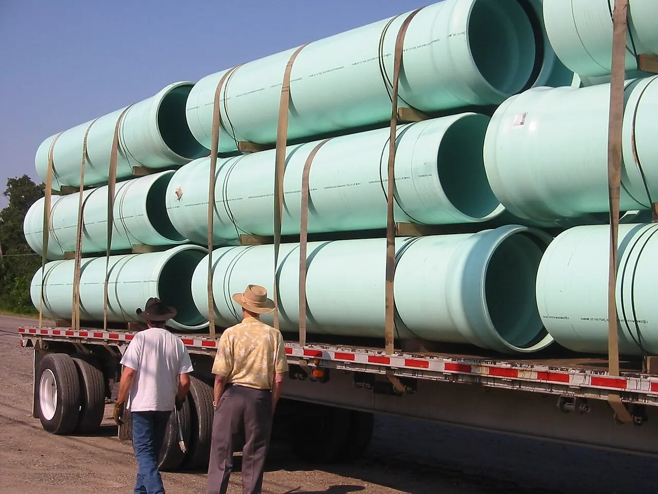 Large water pipes loaded on a flatbed truck