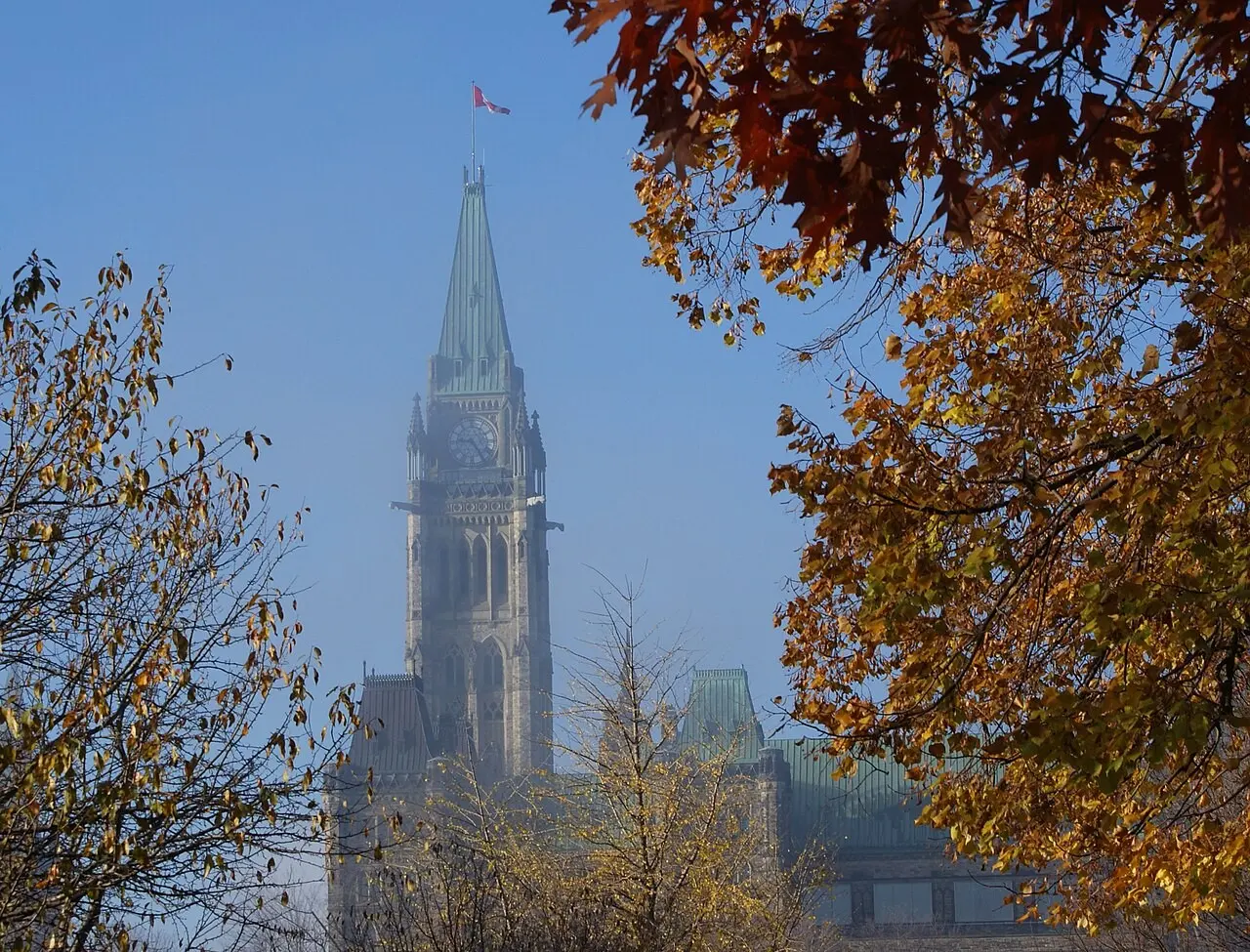 Peace Tower glimpsed through autumn foliage