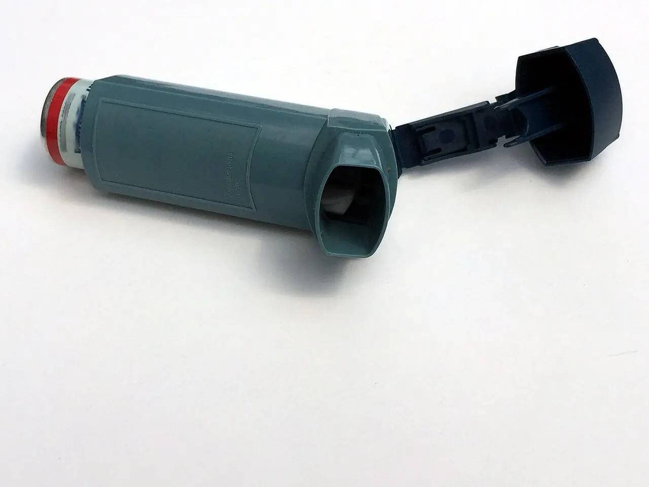 Asthma inhaler on a white background