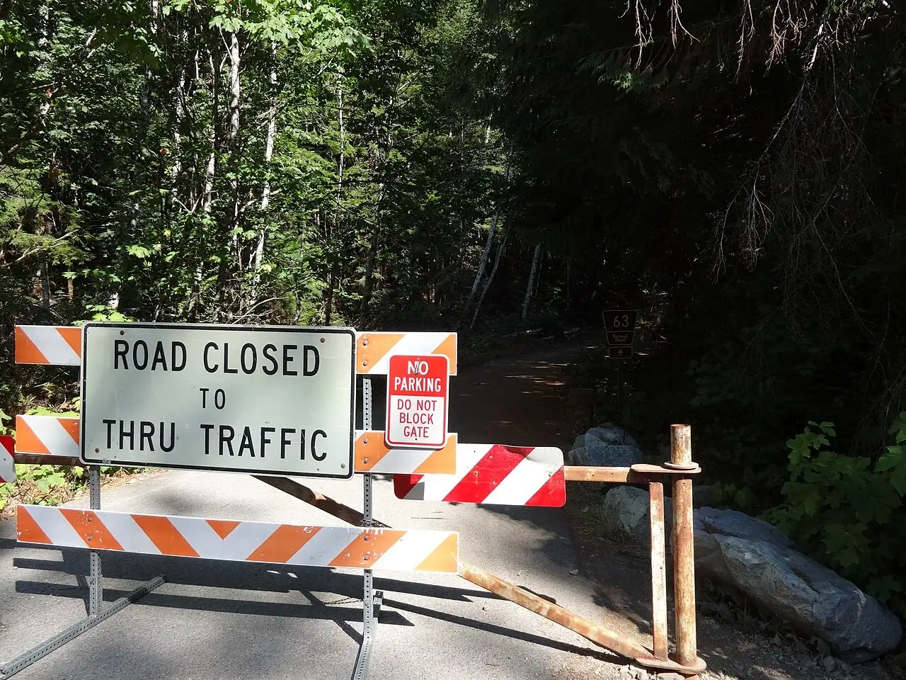 Road closed to through traffic barricade on a forest road