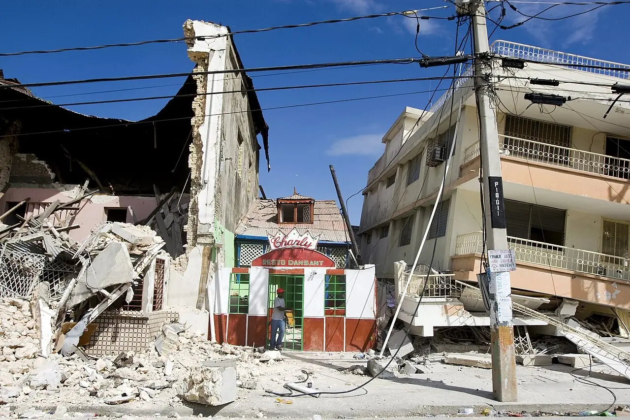 Multi-story building collapsed onto a street